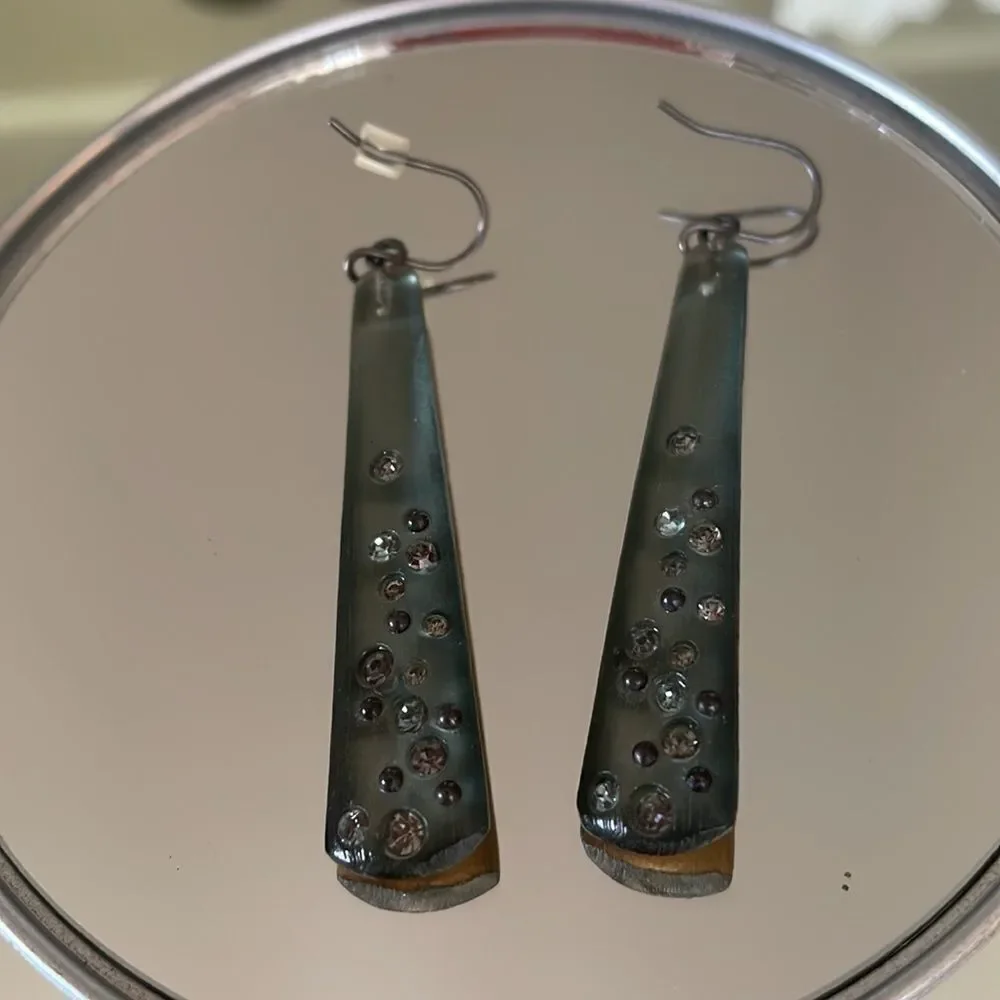 Shiny gray plastic dangle wire earrings embedded with‎ small rhinestones